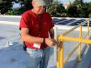 Puerto Rico Section Manager Oscar Resto, KP4RF, installs an antenna at Red Cross Headquarters in San Juan.